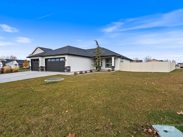 view of front of house featuring a front lawn and a garage