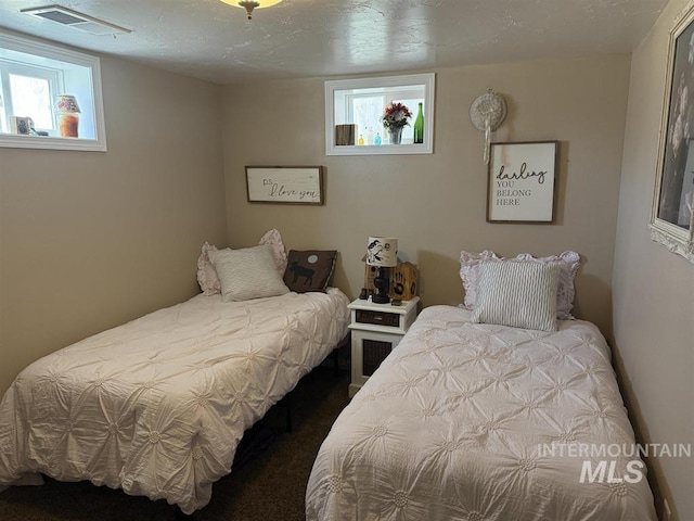 bedroom featuring visible vents