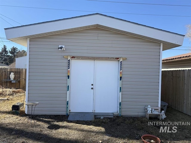 view of shed with fence