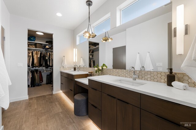 4213 E Divide Pass St, Meridian, ID 83642 - bathroom with vanity, a walk in closet, and recessed lighting