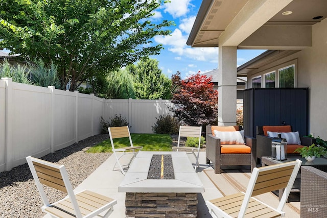 4213 E Divide Pass St, Meridian, ID 83642 - fenced backyard featuring a patio area and an outdoor hangout area