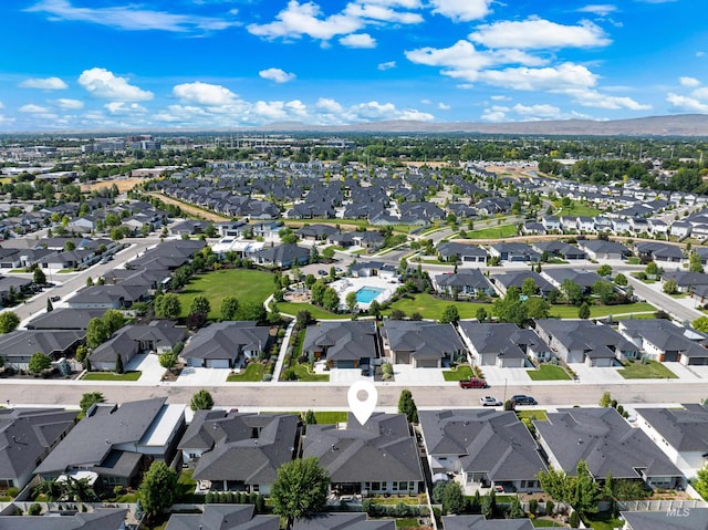 4213 E Divide Pass St, Meridian, ID 83642 - aerial view of property's location with nearby suburban area and a mountain backdrop