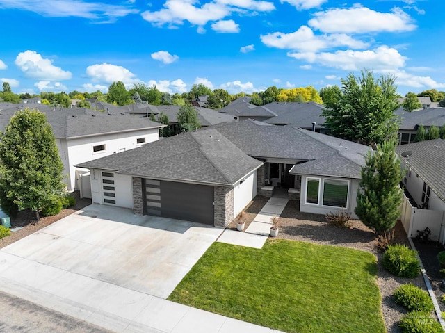 4213 E Divide Pass St, Meridian, ID 83642 - view of front of house with a garage, a shingled roof, a residential view, and concrete driveway