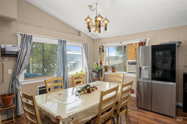 642 Oak St, Twin Falls, ID 83301 - dining room featuring vaulted ceiling, a chandelier, and dark wood finished floors