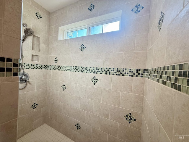 full bathroom featuring a tile shower