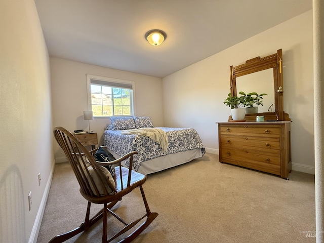 carpeted bedroom featuring baseboards