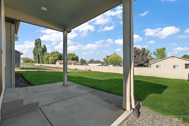 view of patio / terrace featuring fence