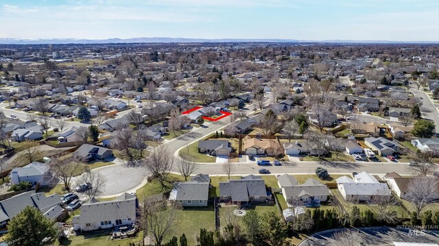 birds eye view of property with a residential view