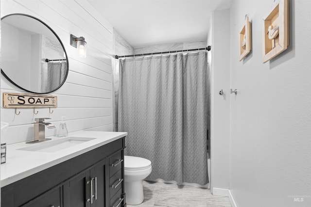 3404 Chukar Ln, Clarkston, WA 99403 - full bathroom featuring marble look tile flooring, vanity, toilet, curtained shower, and wood walls