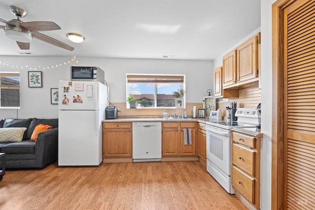 3404 Chukar Ln, Clarkston, WA 99403 - kitchen with white appliances, ceiling fan, light wood finished floors, open floor plan, and light countertops