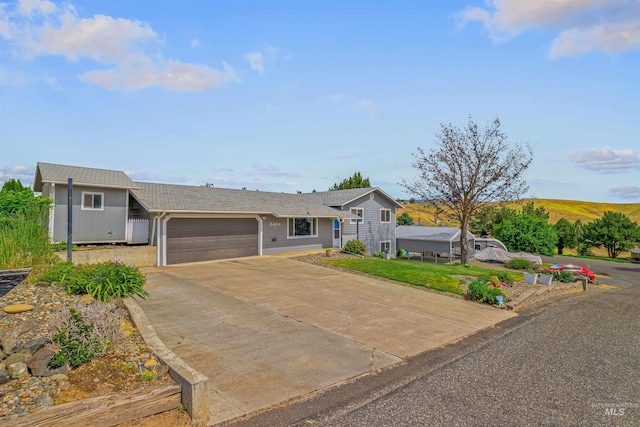 3404 Chukar Ln, Clarkston, WA 99403 - view of front of house featuring a garage and concrete driveway