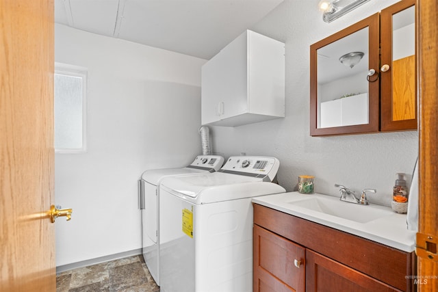 3404 Chukar Ln, Clarkston, WA 99403 - laundry room with cabinet space, separate washer and dryer, and stone finish floors
