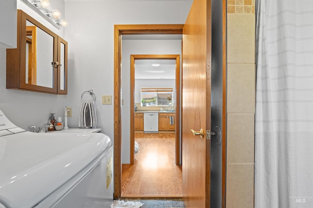 3404 Chukar Ln, Clarkston, WA 99403 - full bath with washer / dryer, wood finished floors, and a shower with curtain