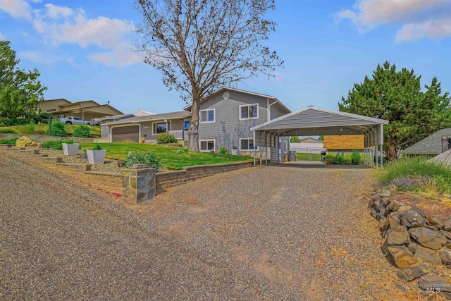 3404 Chukar Ln, Clarkston, WA 99403 - view of front of house featuring gravel driveway, a detached carport, and a front lawn