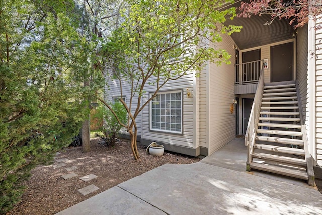 doorway to property featuring a patio area