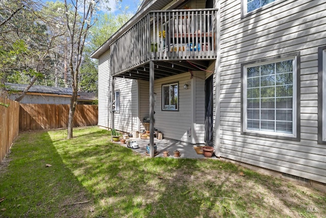exterior space with a fenced backyard, a yard, and a patio