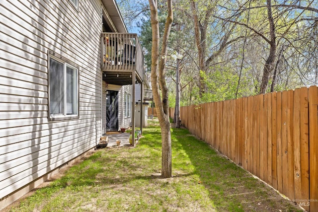 view of yard with a fenced backyard