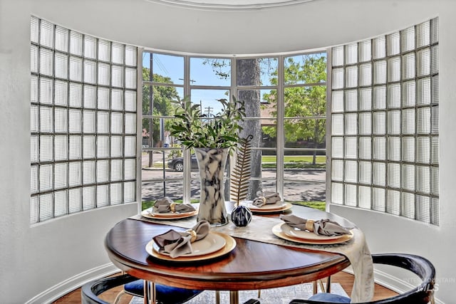 dining area featuring baseboards