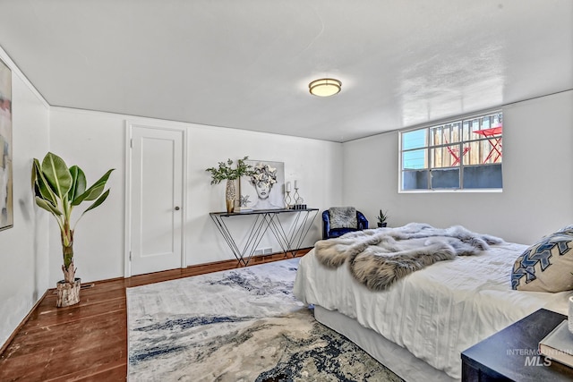 bedroom with wood finished floors