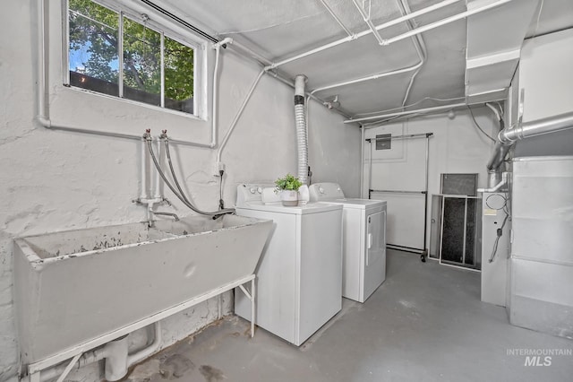 below grade area featuring washer and clothes dryer