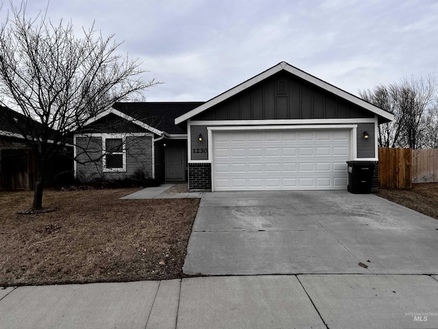 single story home featuring an attached garage, brick siding, fence, concrete driveway, and board and batten siding