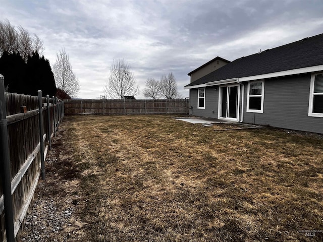 view of yard with a fenced backyard and a patio