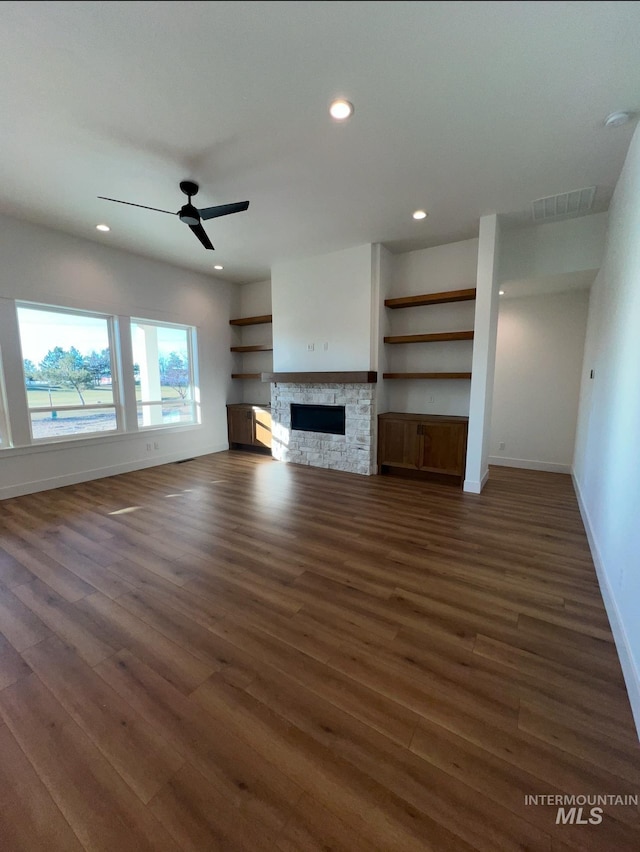 11233 S Saylis Pl, Kuna, ID 83634 - unfurnished living room featuring dark hardwood / wood-style flooring, a fireplace, and ceiling fan