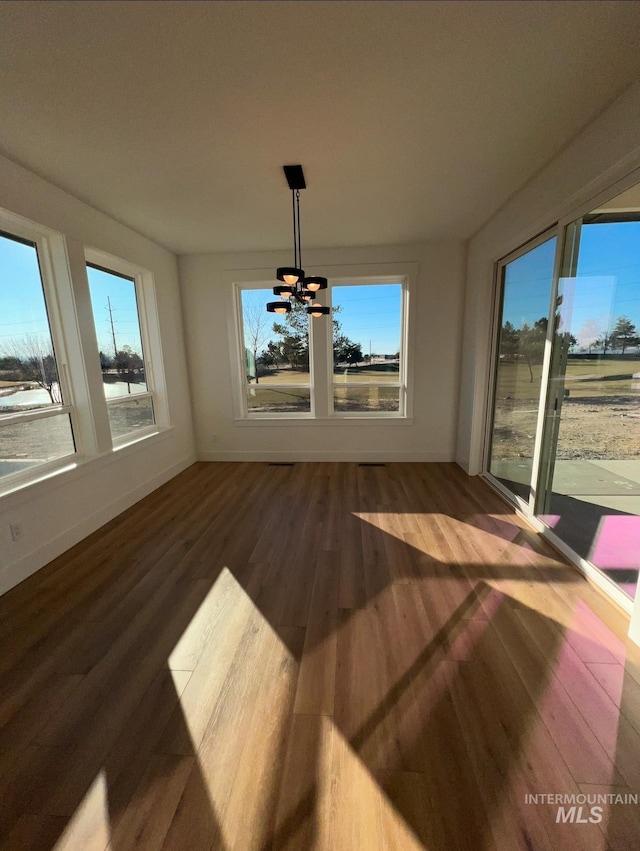 11233 S Saylis Pl, Kuna, ID 83634 - unfurnished dining area with hardwood / wood-style flooring and a chandelier