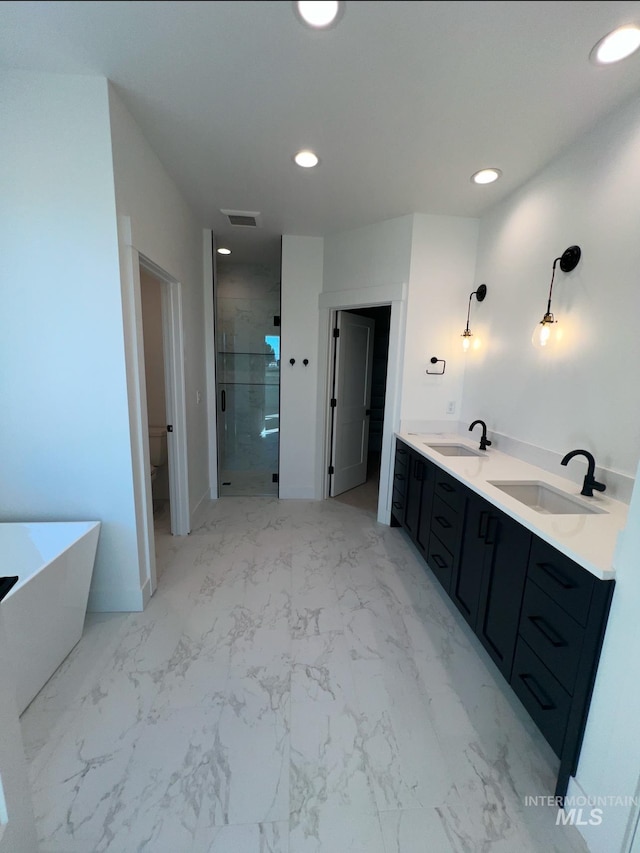 11233 S Saylis Pl, Kuna, ID 83634 - full bathroom featuring vanity, shower with separate bathtub, and toilet