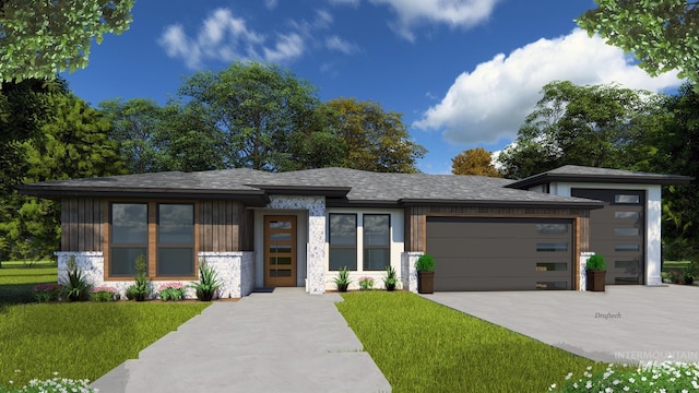 prairie-style house featuring a garage and a front lawn