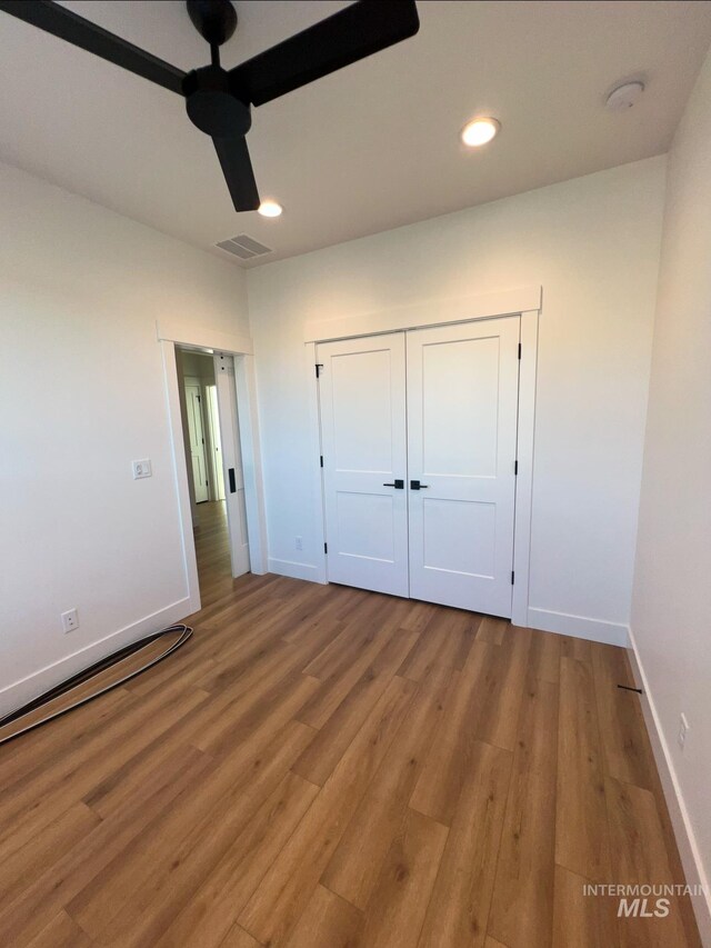 11233 S Saylis Pl, Kuna, ID 83634 - unfurnished bedroom featuring ceiling fan, a closet, and light hardwood / wood-style flooring