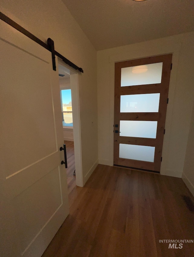 entryway featuring hardwood / wood-style floors and a barn door