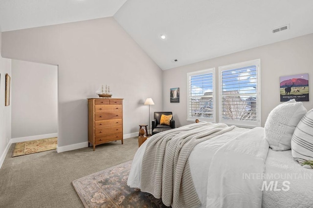 carpeted bedroom with high vaulted ceiling, visible vents, and baseboards