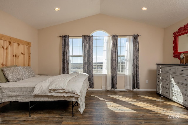 bedroom featuring lofted ceiling, dark wood finished floors, baseboards, and recessed lighting