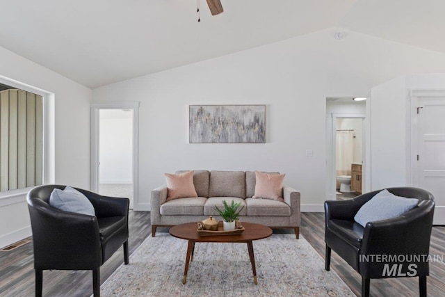 living area with lofted ceiling, visible vents, a ceiling fan, wood finished floors, and baseboards