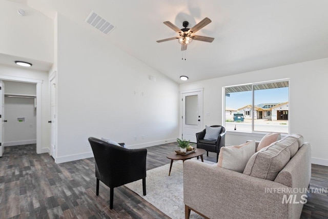 living area with dark wood-style flooring, visible vents, ceiling fan, and baseboards