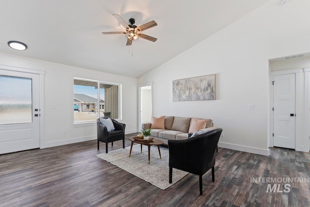 living room with dark wood-type flooring, baseboards, and a ceiling fan