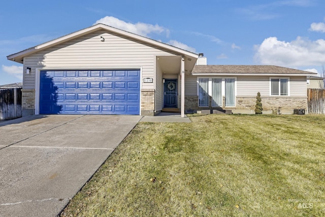 ranch-style home with a garage and a front yard