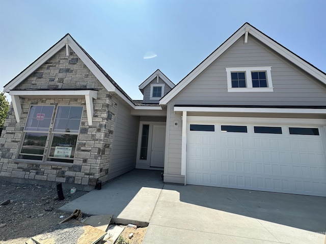 1149 E Crescendo St, Meridian, ID 83642 - view of front of property with stone siding and driveway