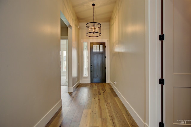 1149 E Crescendo St, Meridian, ID 83642 - foyer entrance featuring a chandelier and light wood-style flooring