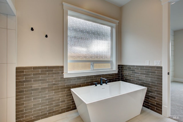 1149 E Crescendo St, Meridian, ID 83642 - full bathroom with tile walls, a soaking tub, and wainscoting