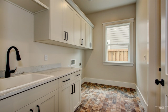 1149 E Crescendo St, Meridian, ID 83642 - laundry room with hookup for an electric dryer, cabinet space, washer hookup, and brick flooring