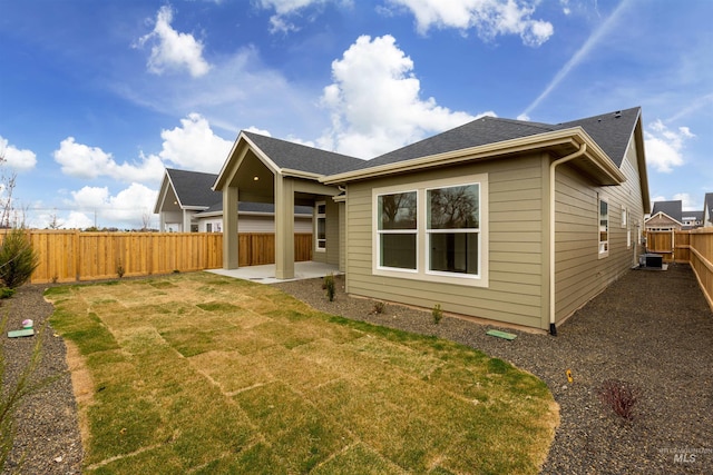 1149 E Crescendo St, Meridian, ID 83642 - rear view of property with a patio, a fenced backyard, and a shingled roof