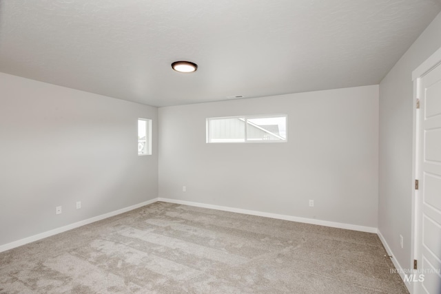 empty room with light colored carpet