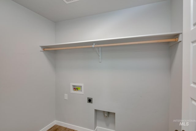 washroom featuring hookup for a washing machine, wood-type flooring, and hookup for an electric dryer