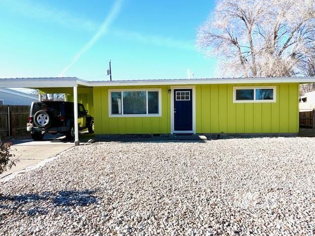 single story home featuring a carport