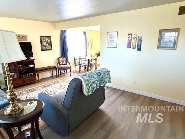 living room with dark wood-type flooring