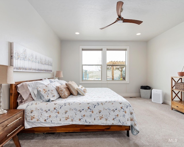 carpeted bedroom with recessed lighting, baseboards, and ceiling fan