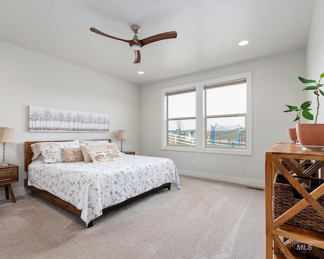 bedroom with recessed lighting, visible vents, baseboards, and light colored carpet