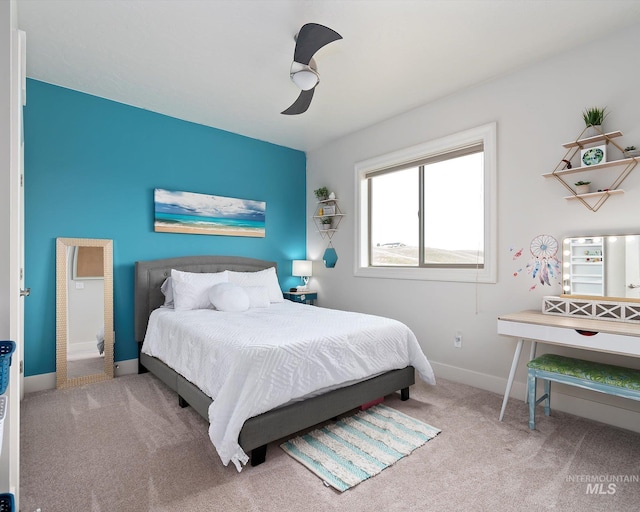 bedroom featuring baseboards, ceiling fan, and carpet flooring